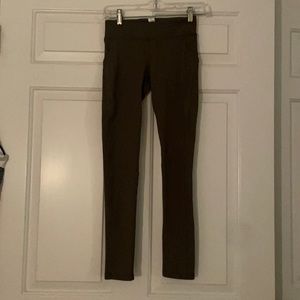 Dark green Ivivva full length low wasted leggings.